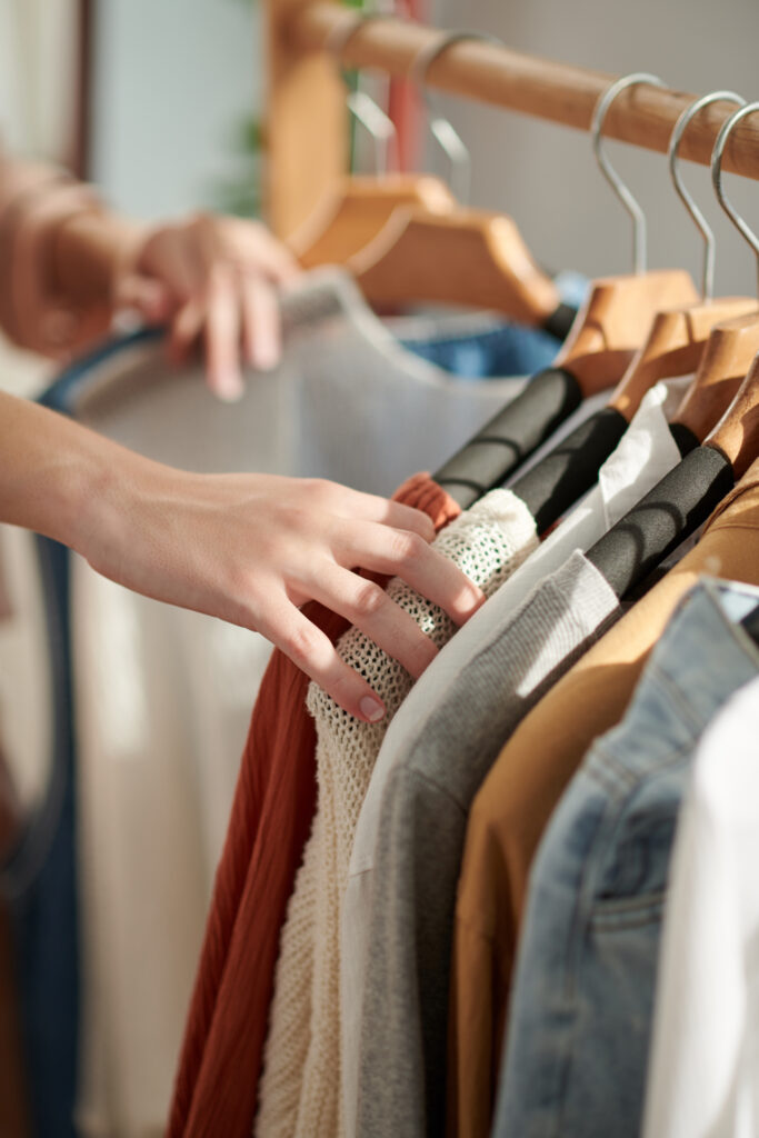 Woman Choosing Clothes in Closet